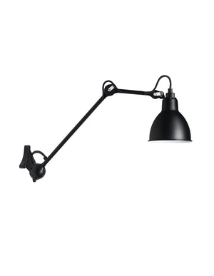 Steel wall lamp. It punctuates the corridors and walls, and likes to chat with the mirrors. It holds its own illuminating the tops