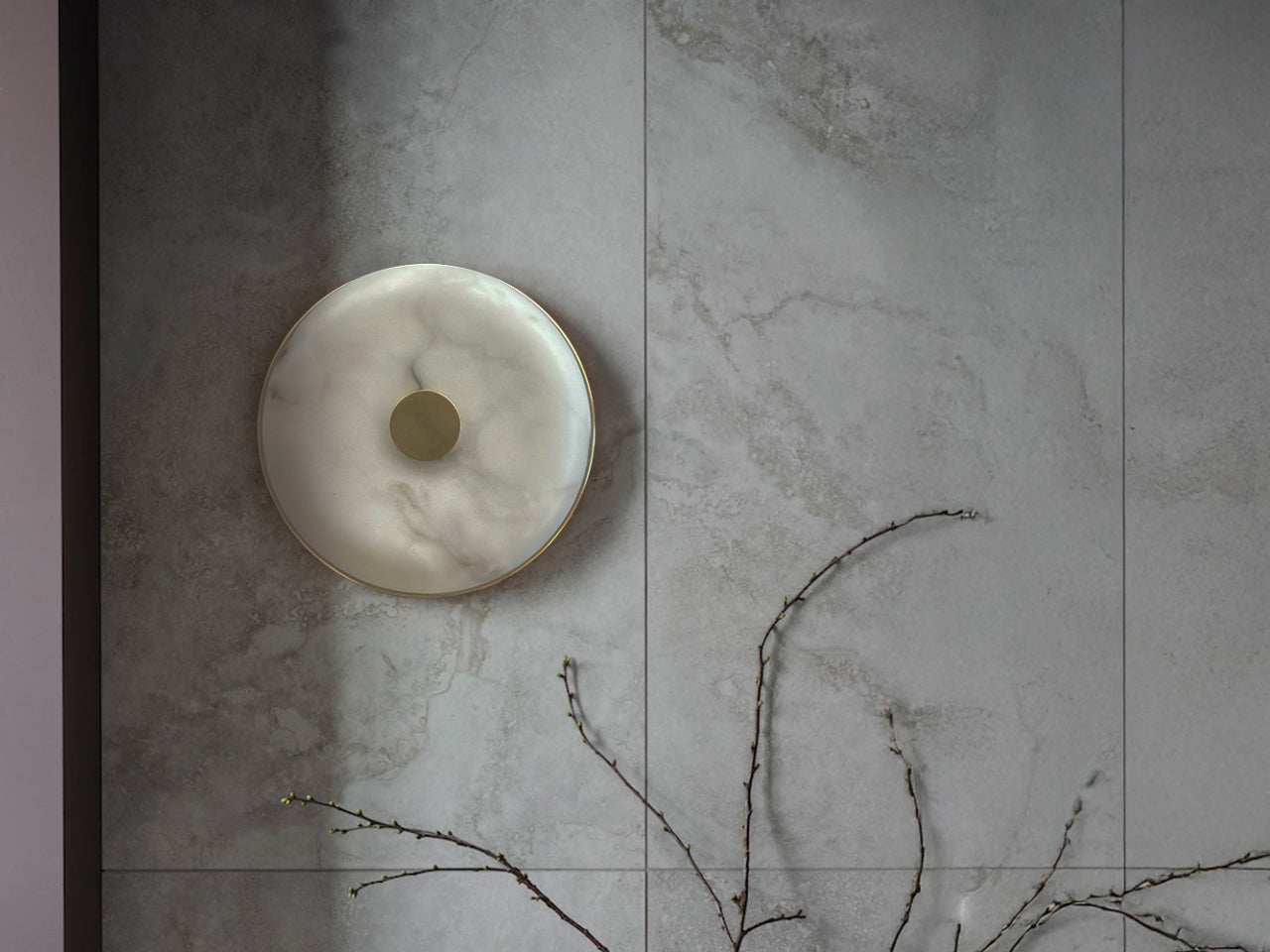 Round ceramic dish on a textured stone surface with a branch in the foreground