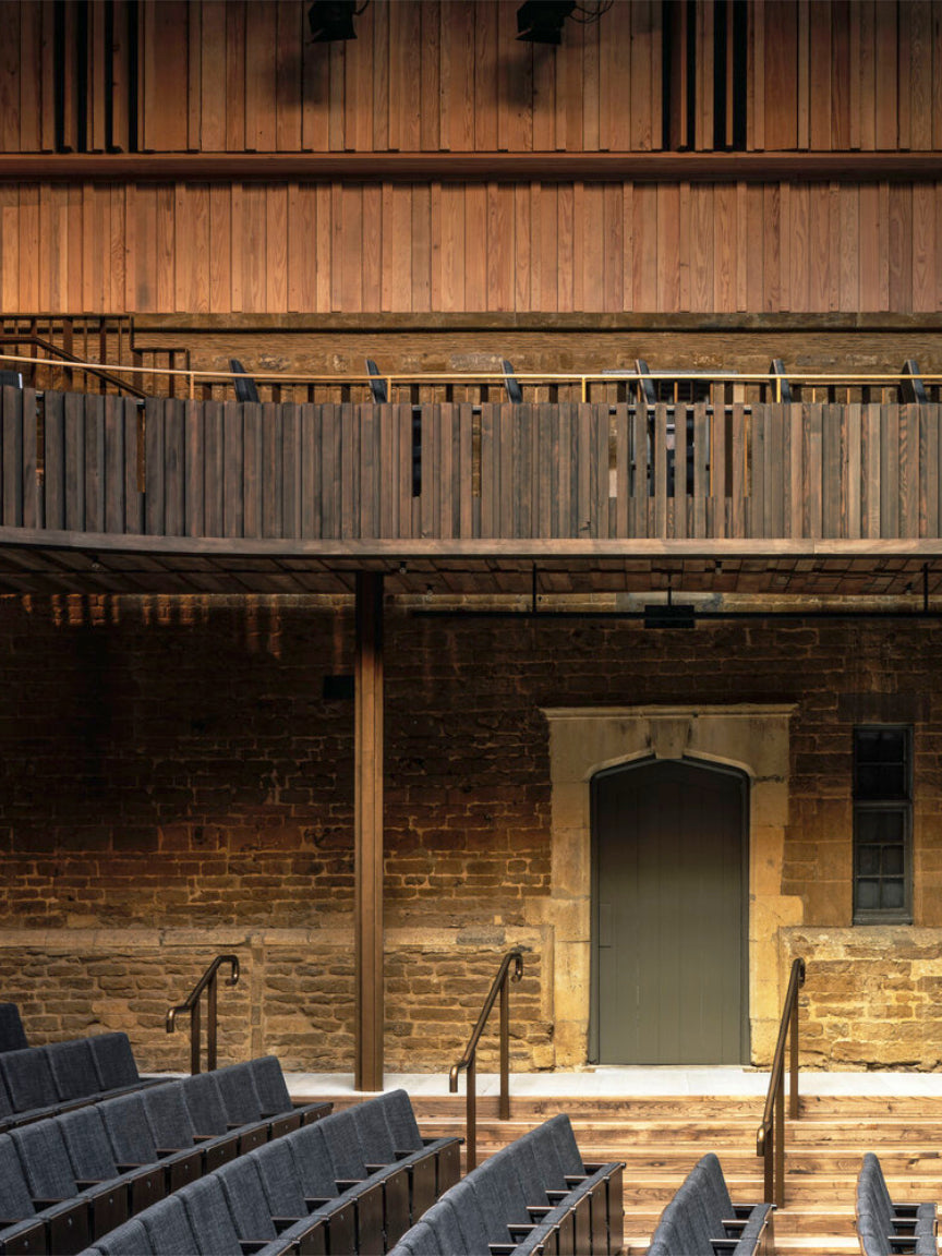 Wooden theater with seating and balcony