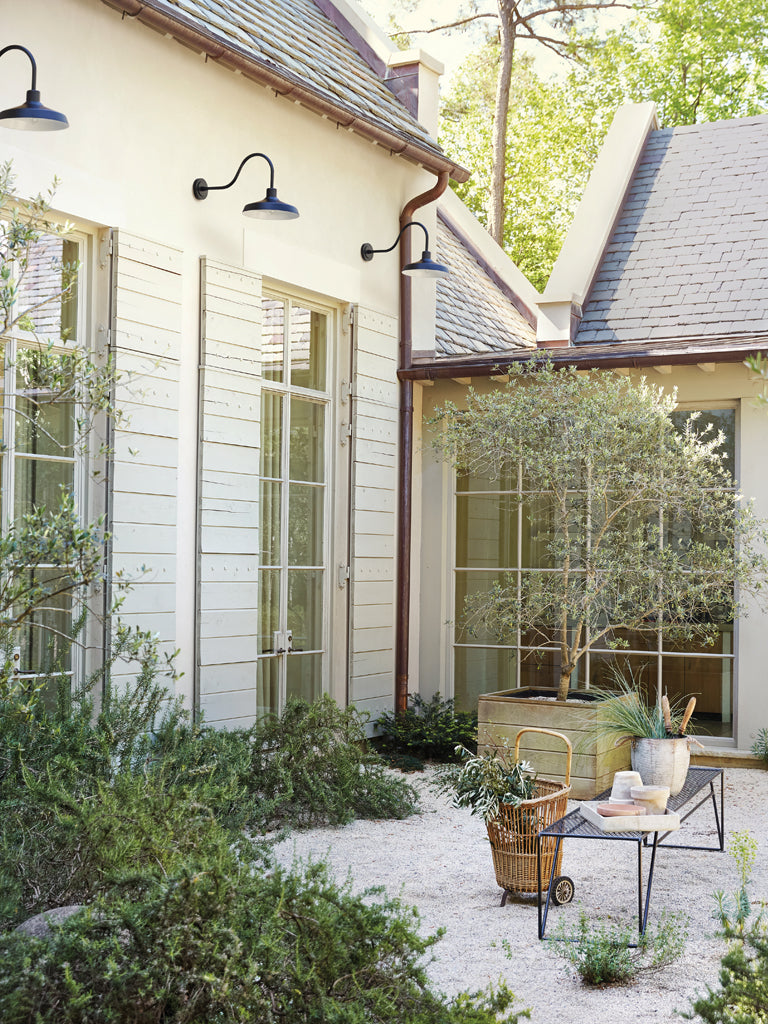 Outdoor patio area with a house in the background